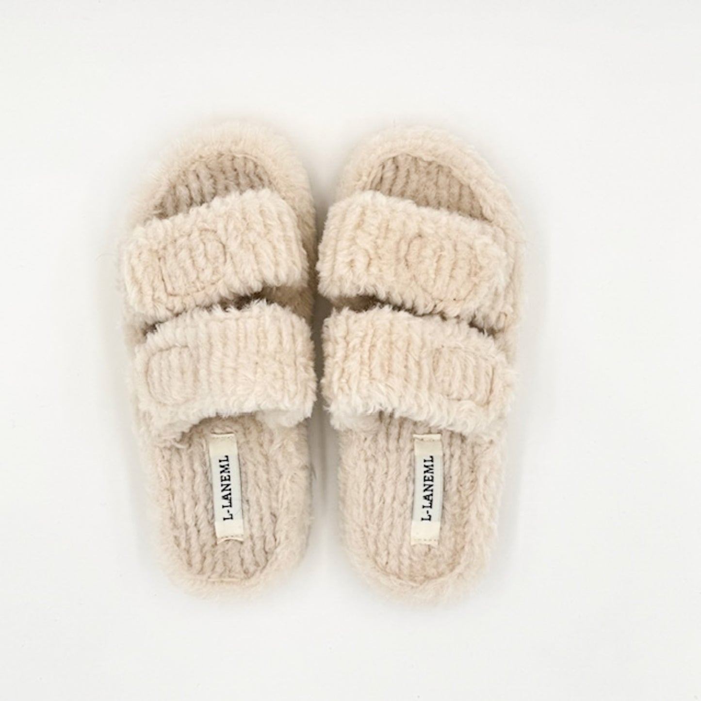 Faux shearling slippers in cream
