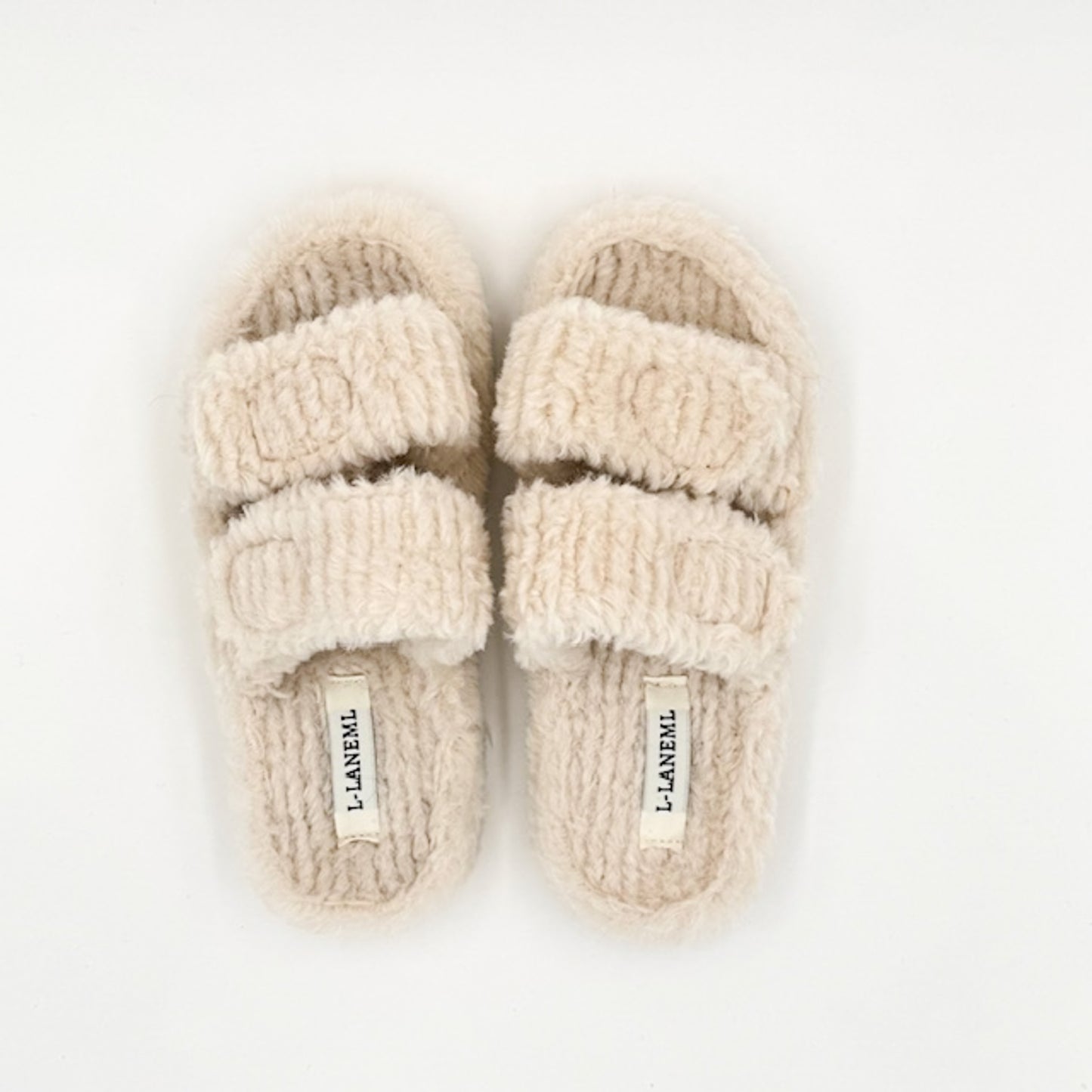 Faux shearling slippers in cream